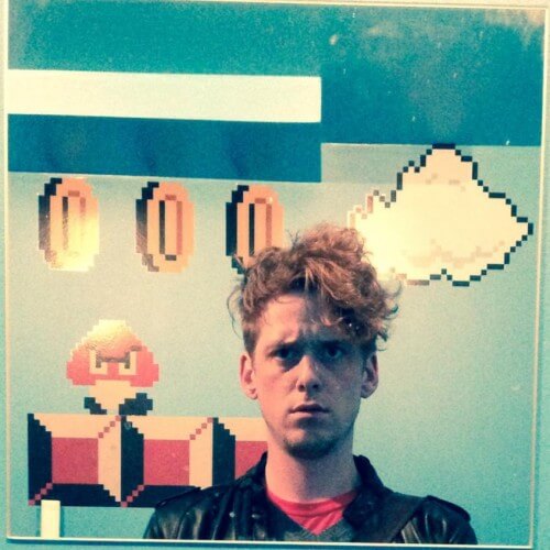 A profile image showing martin in front of a super mario wall paint